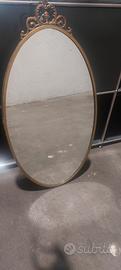 specchio ovale in ottone