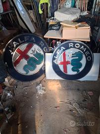 Due insegne luminose Alfa Romeo