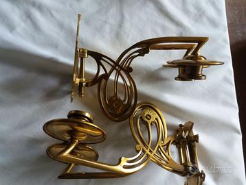 Due portacandele in rame in stile art déco