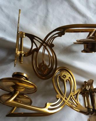 Due portacandele in rame in stile art déco