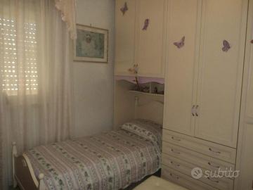 Camera con armadio a ponte