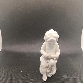 statua Putto incisore Capodimonte 