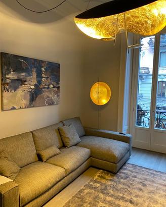 Divano angolare 296x158 cm in tessuto grigio/torto