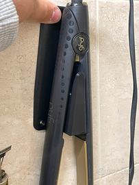 Riponi piastra per capelli che si attacca al muro