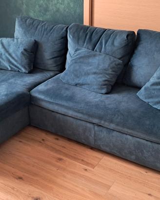 Divano letto a  penisola con contenitore.