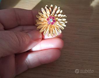 Spilla in oro, rubini e brillantino 