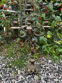 Candelabro antico con putto