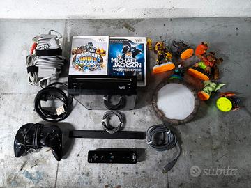 Wii + cavi + joystick + Pad + giochi