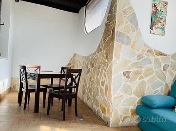 Appartamento con giardino e posto auto