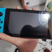 Nintendo switch con joycon rosso rotto