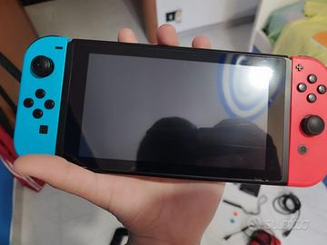 Nintendo switch con joycon rosso rotto