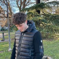 Giacca Moncler imbottita con maniche in maglia – o