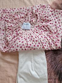 maglia rosa con pantaloni bianchi