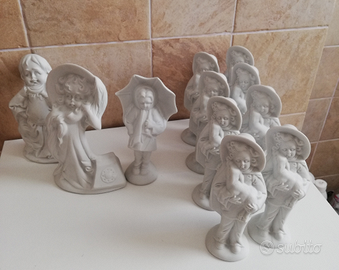 Lotto 11 statuine bisquit Capodimonte