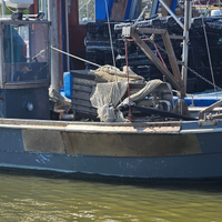 Barca attrezzata per la pesca delle Vongole