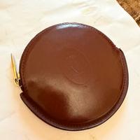 Portamonete rotondo Must Cartier pelle bordeaux