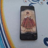 tozzetto di legno con raffigurazione bambinello