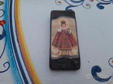 tozzetto di legno con raffigurazione bambinello