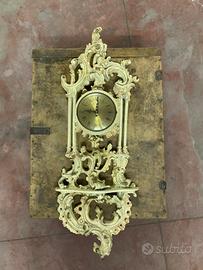 Orologio da parete in legno intagliato