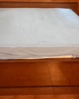 Letto matrimoniale con testiera contenitore