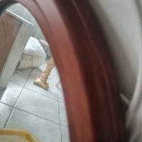 specchio ovale con cornice in noce 