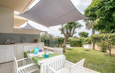 Appartamento vista mare con giardino