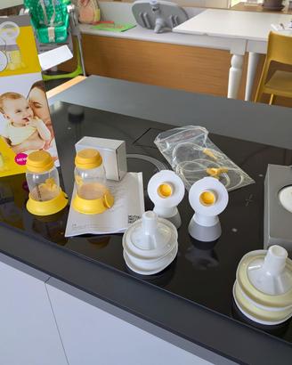 Tiralatte Medela Swing Maxi + scaldabiberon
