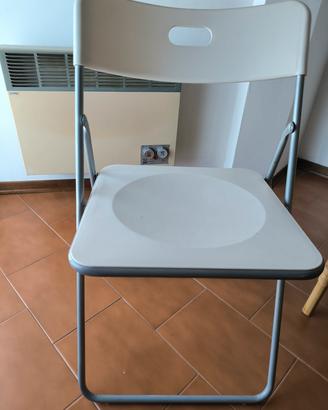 Tre sedie richiudibili 