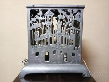 Stufetta elettrica in ghisa trasformata in lampada