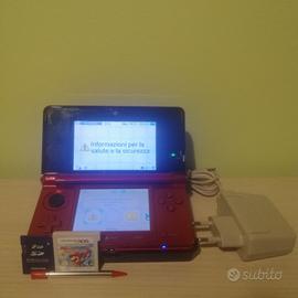 Nintendo 3ds rosso con gioco e base di ricarica 