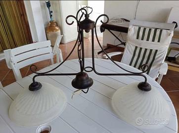 Lampadario in vetro lavorato e acciaio