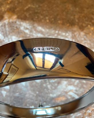 Cornice cerchietto faro Aprilia da 150 Gilera ecc.