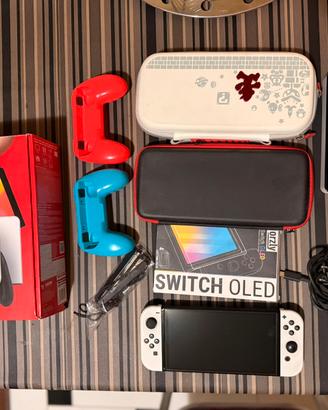NINTEDO SWITCH OLED + ZELDA: BOTW + ACCESSORI
