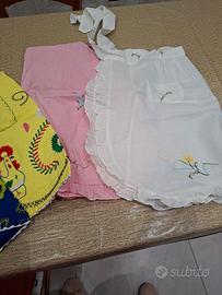 grembiuli ricamati a mano sono 4