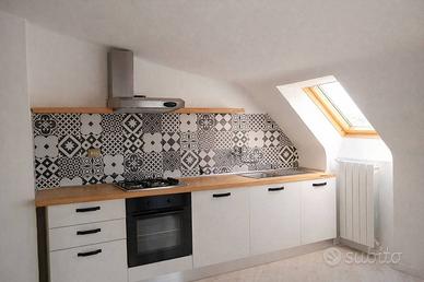 Mansarda ristrutturata e arredata con rendita atti