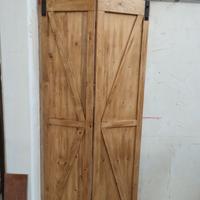 Porta scorrevole a libro in legno massello