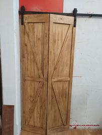 Porta scorrevole a libro in legno massello