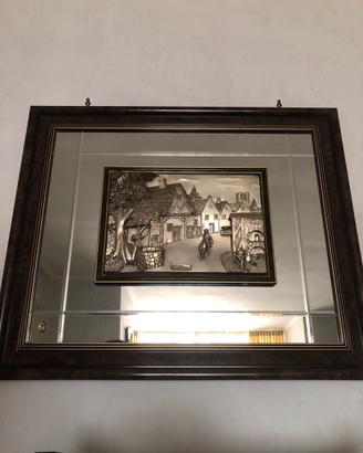 Quadro specchio con lastra d’argento in rilievo
