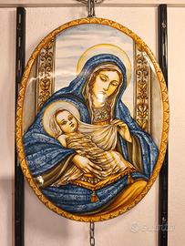 Immagini sacre su ceramica e legno