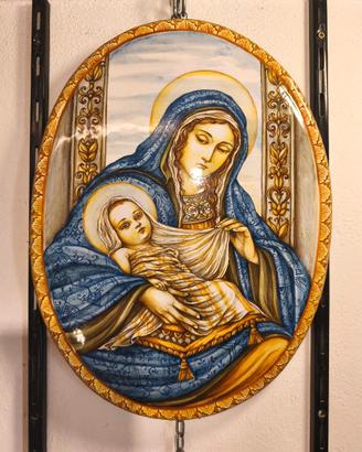 Immagini sacre su ceramica e legno