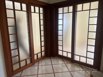 Porta scorrevole doppia a scomparsa in puro legno