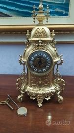 orologio con pendolo in ottone 