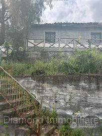Casetta panoramica con terreno a Milo