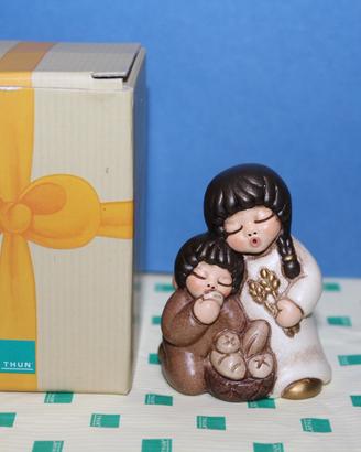 Presepe Thun - Bimbi che mangiano il pane -