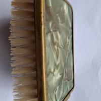 Spazzola abiti vintage bordo ottone