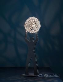 Lampada cattelani Smith. Uomo della luce s