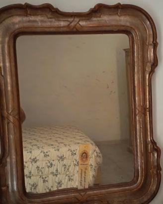 specchio con cornice in bronzo