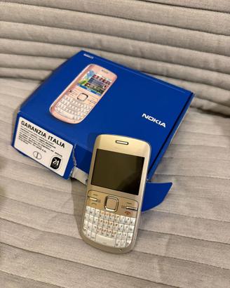 Telefono C3 oro e bianco funzionante.