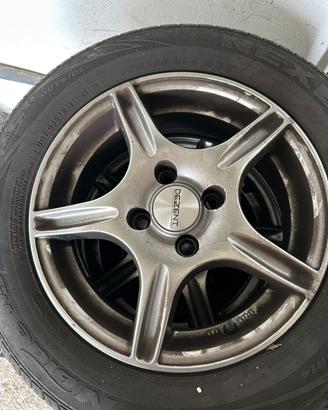 4 cerchi con gomme opel corsa 2004