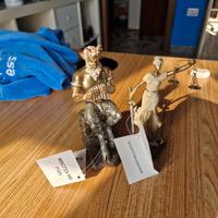 Statuette di Pan e Giustizia 